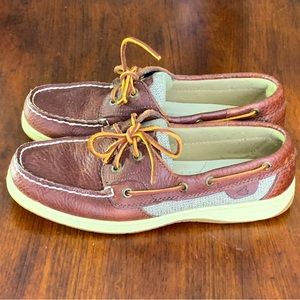 Women’s brown leather and linen boat shoe.